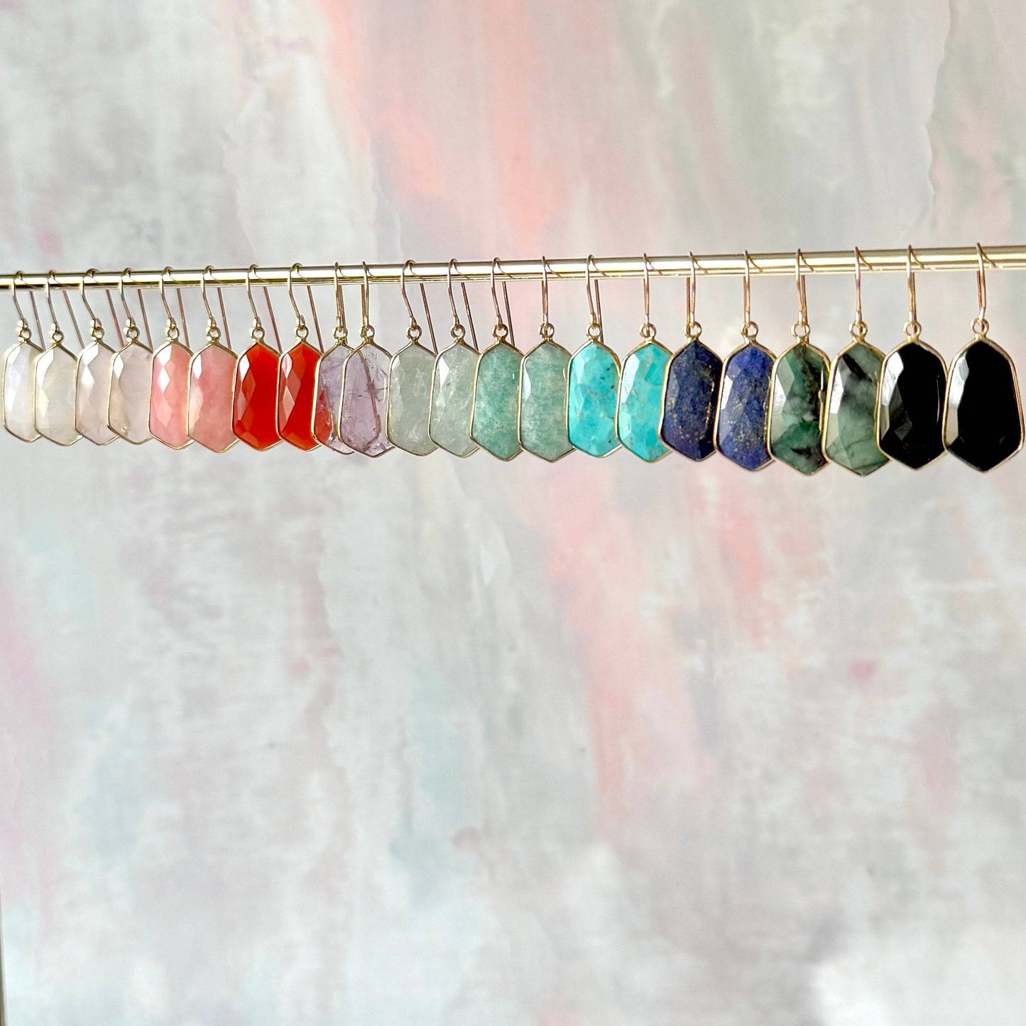 Lydia earrings featuring lightweight, 1-inch gemstone drops in a variety of vibrant stones like moonstone, rose quartz, and turquoise, set in gold-plated frames for a timeless, elegant look