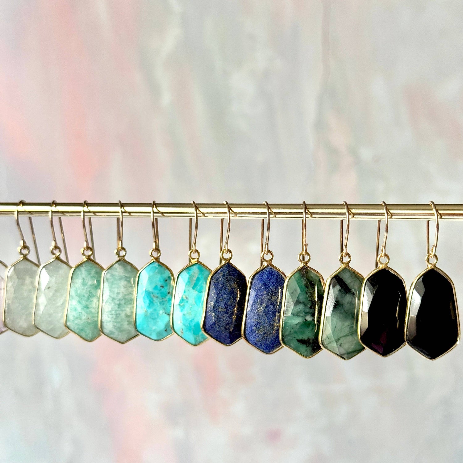 Lydia earrings featuring lightweight, 1-inch gemstone drops in a variety of vibrant stones like moonstone, rose quartz, and turquoise, set in gold-plated frames for a timeless, elegant look
