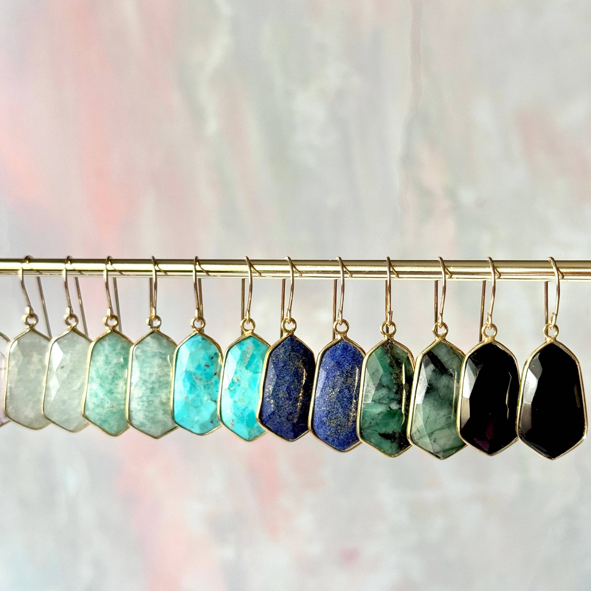 Lydia earrings featuring lightweight, 1-inch gemstone drops in a variety of vibrant stones like moonstone, rose quartz, and turquoise, set in gold-plated frames for a timeless, elegant look