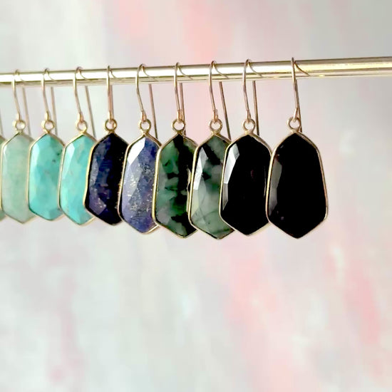 Lydia earrings featuring lightweight, 1-inch gemstone drops in a variety of vibrant stones like moonstone, rose quartz, and turquoise, set in gold-plated frames for a timeless, elegant look
